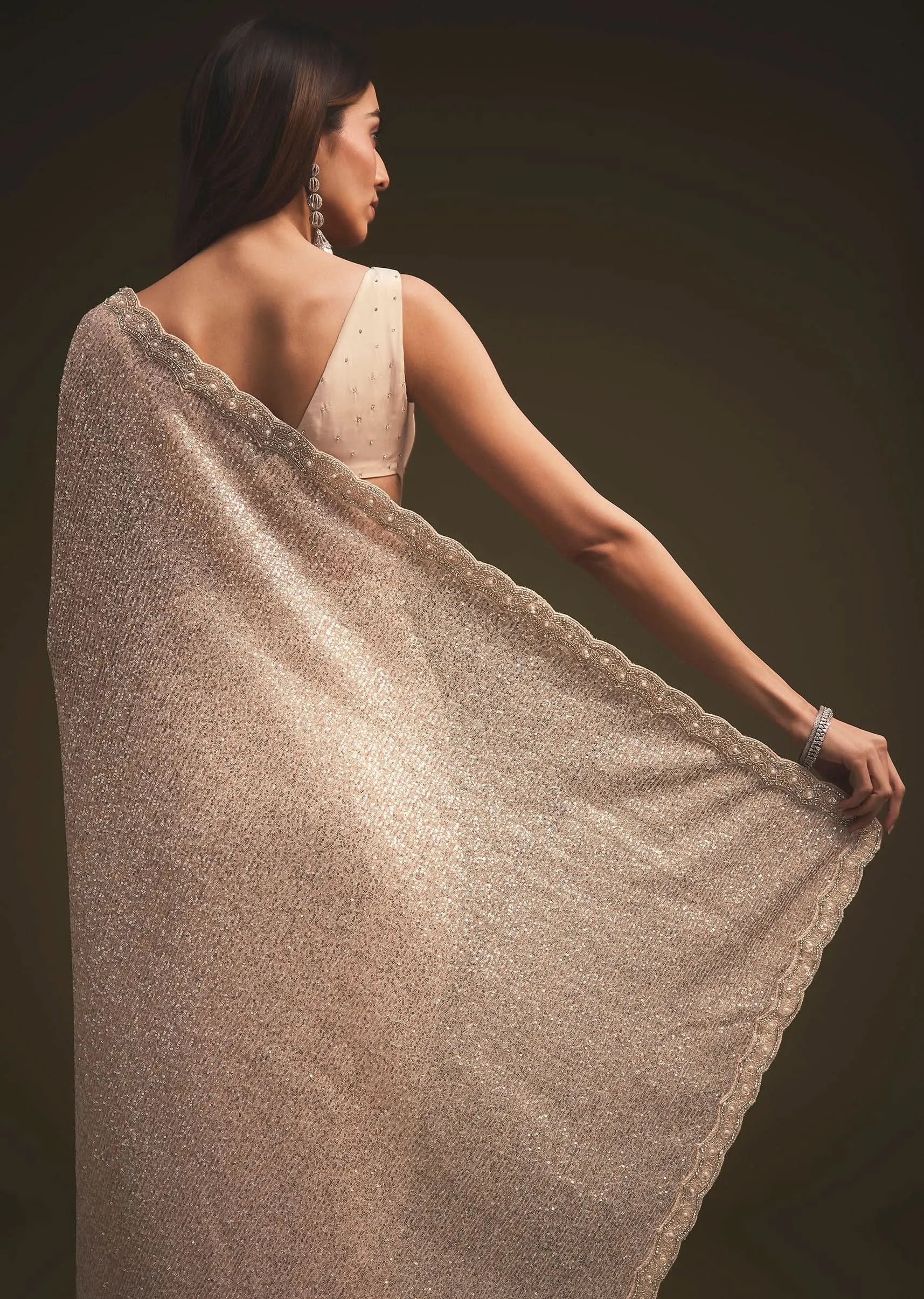 Gold Sequins Saree With An Embellished Border